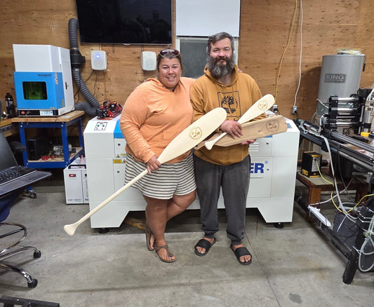 Pat and Tana and their engraved paddles