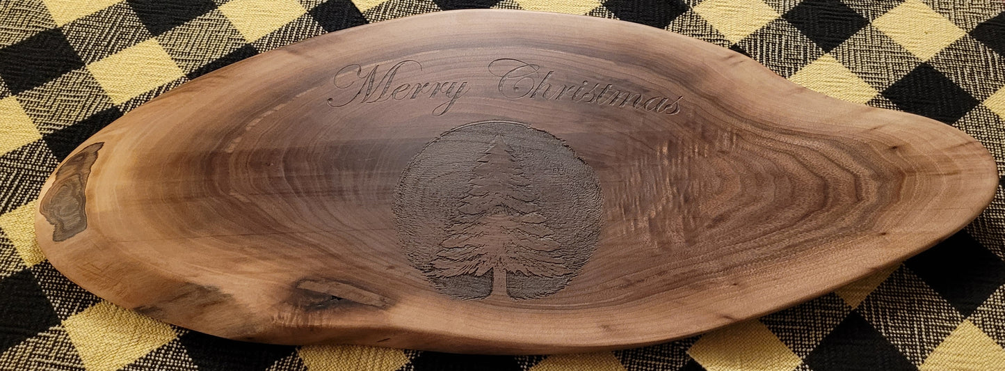 Wooden serving board with 'Merry Christmas' engraving