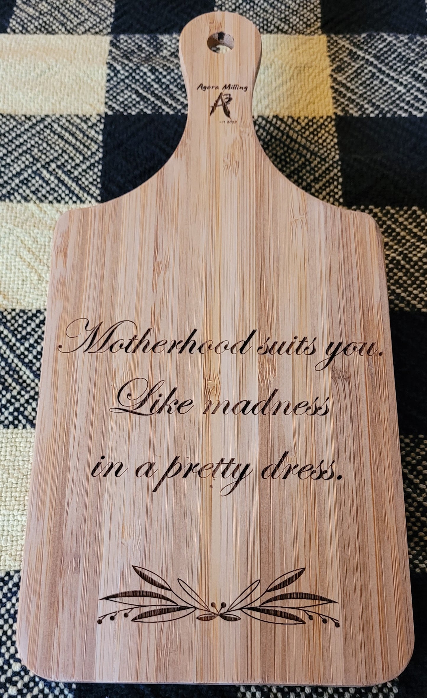 Wooden cutting board with engraved text