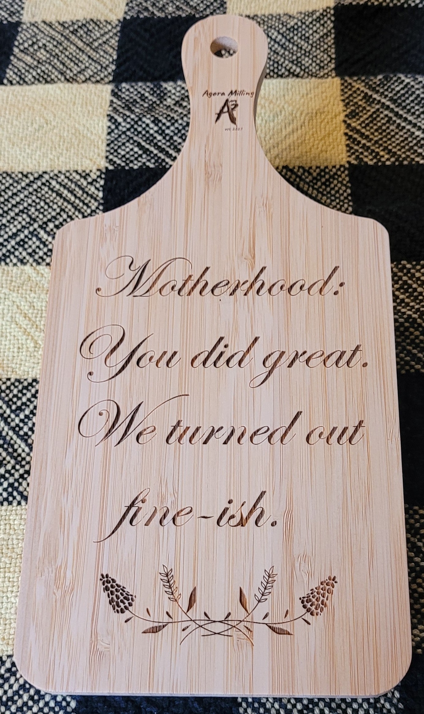 Wooden cutting board with engraved text