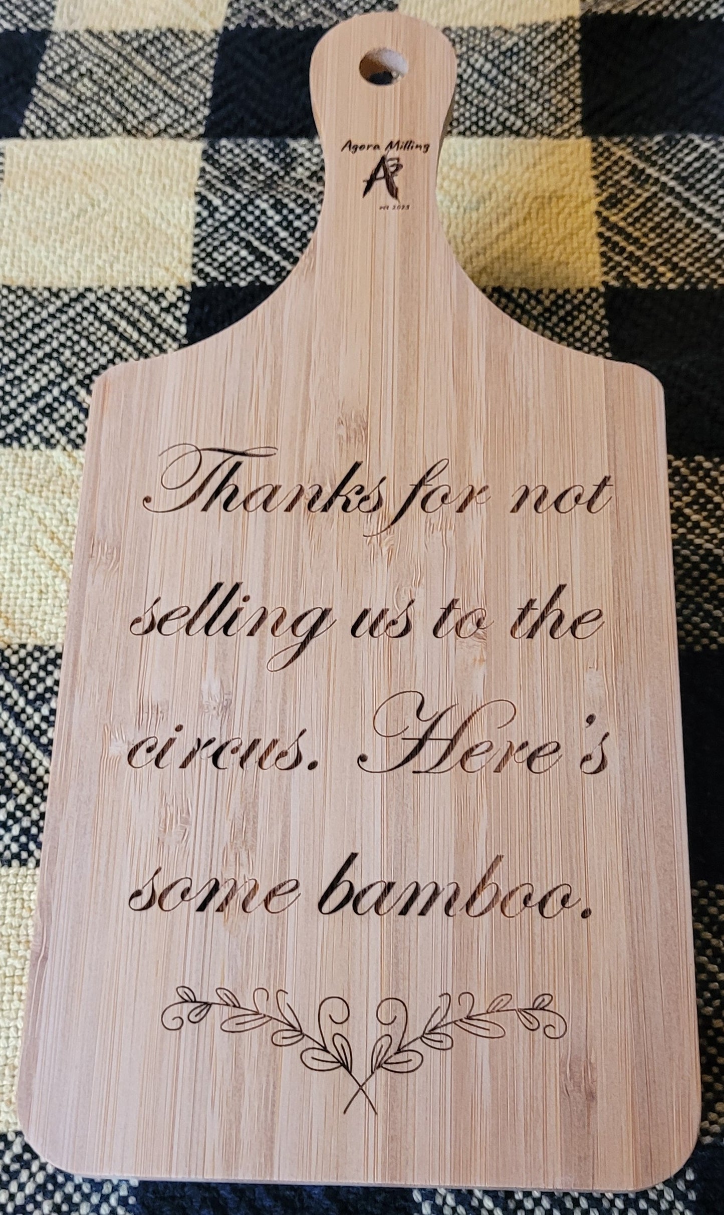 Wooden cutting board with engraved text