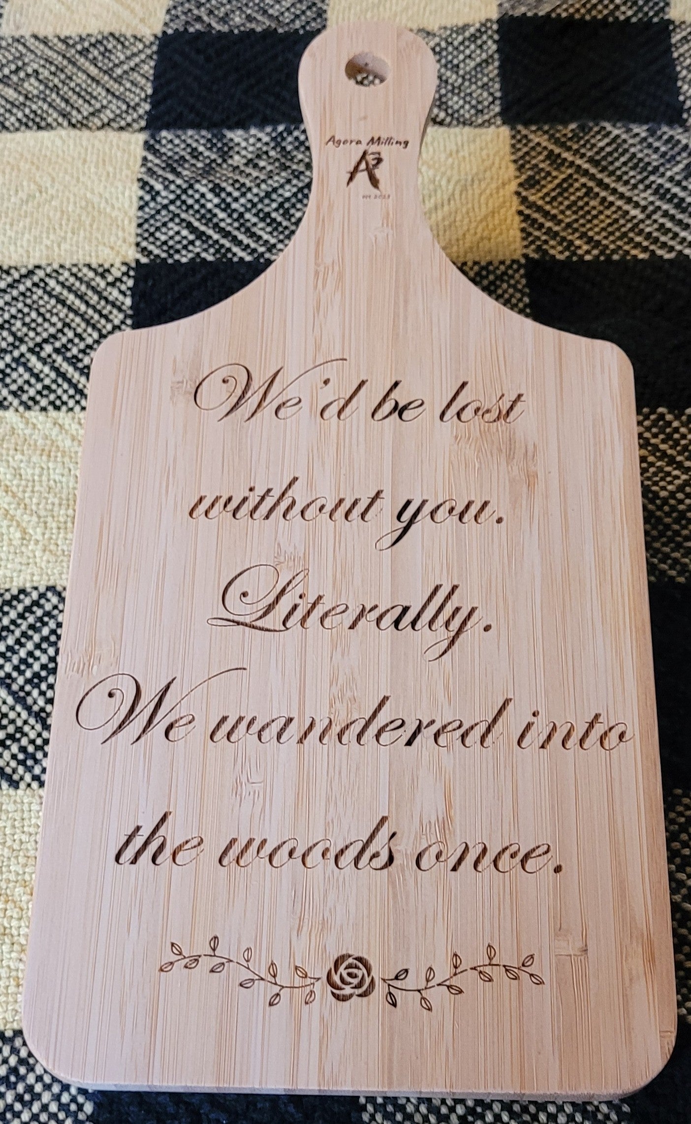 Wooden cutting board with engraved text