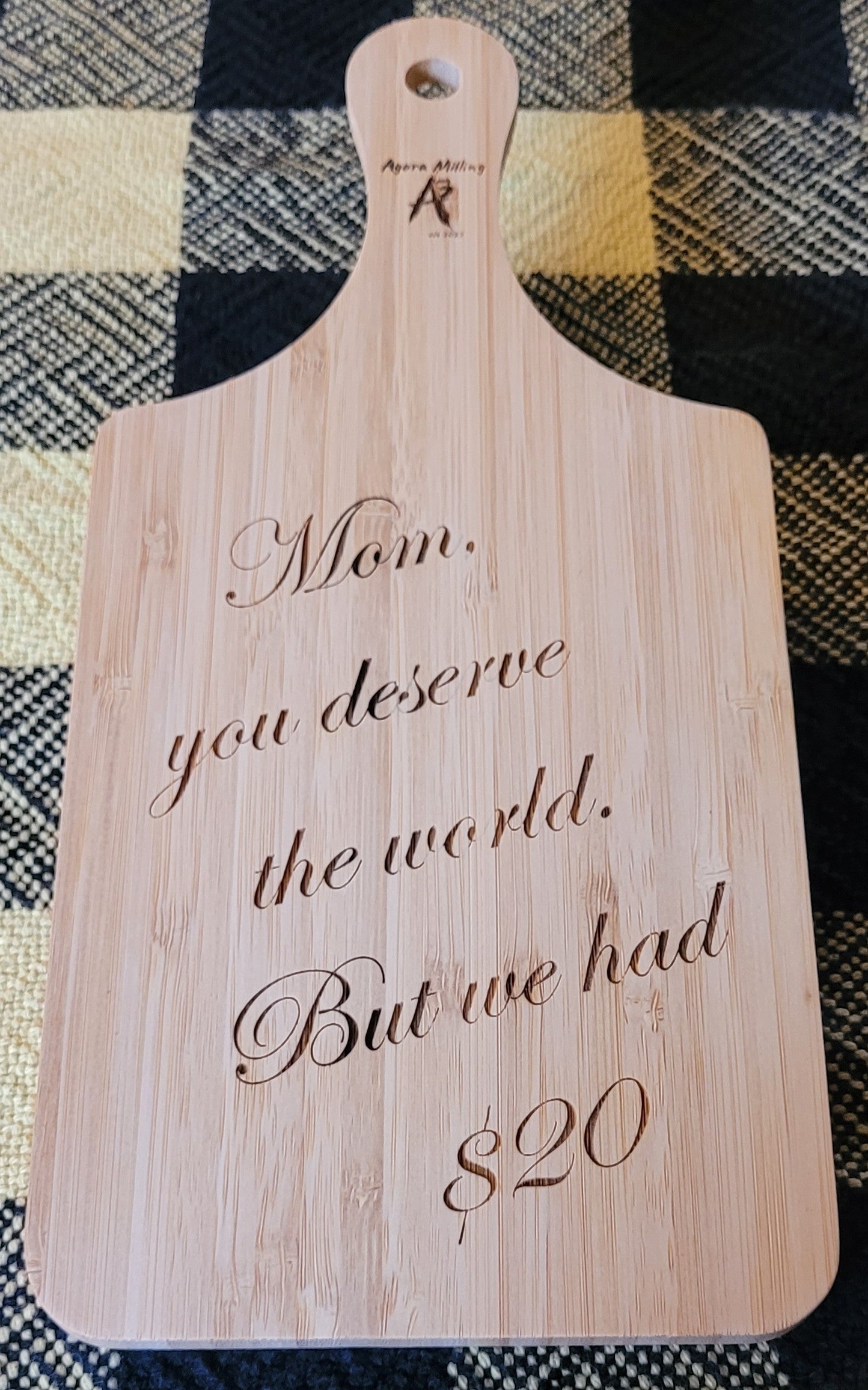 Wooden cutting board with engraved text