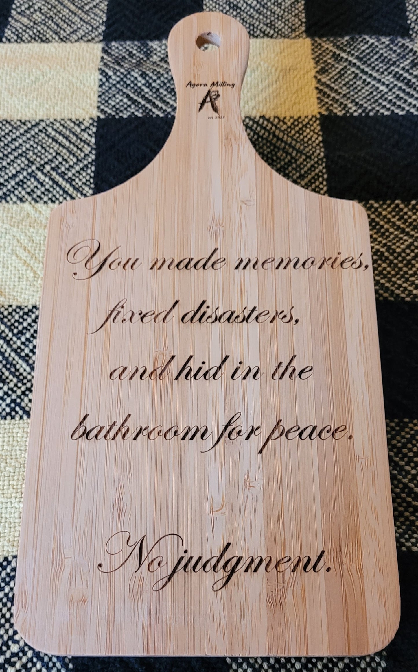 Wooden cutting board with engraved text