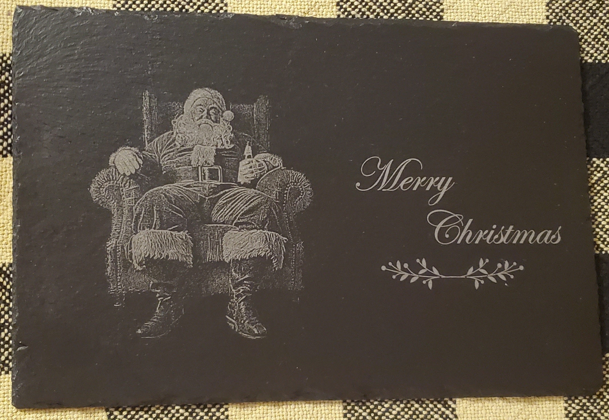 Sleek black slate with engraved Santa Claus and 'Merry Christmas' text