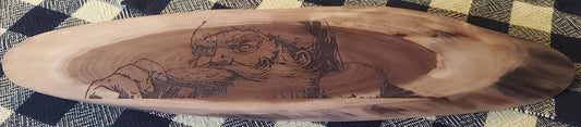 Wooden cutting board with engraved design