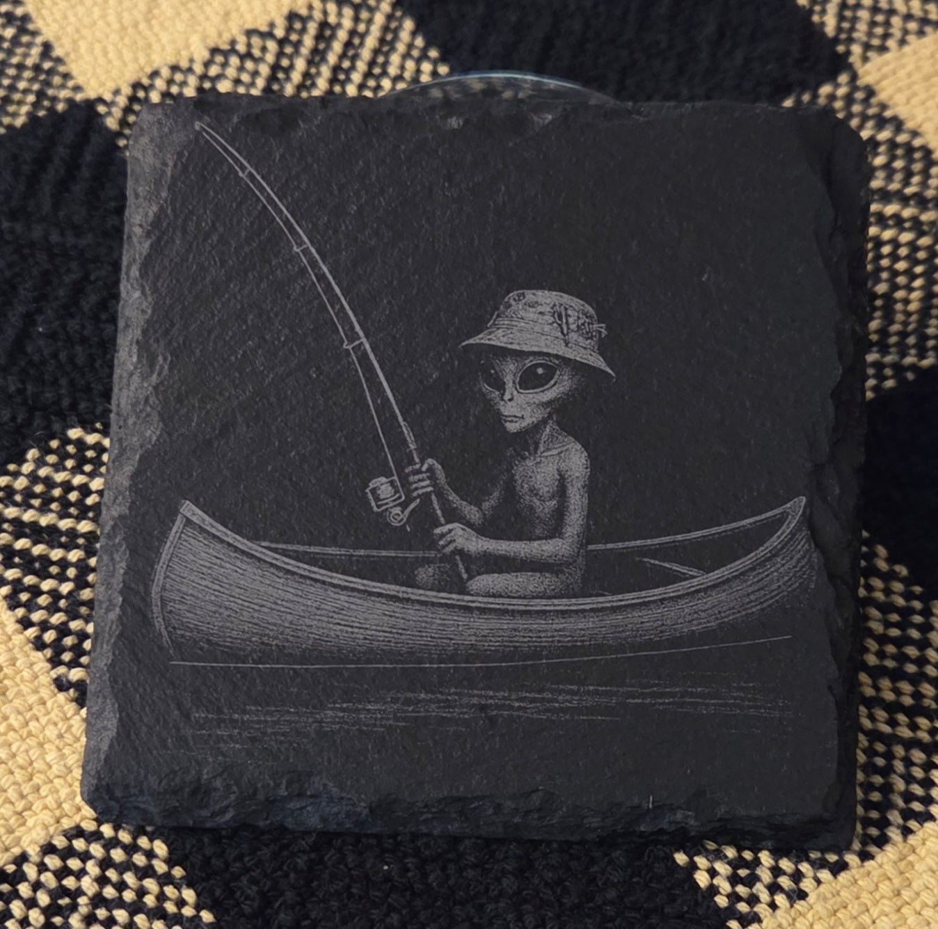 Steve fishing from a canoe coaster