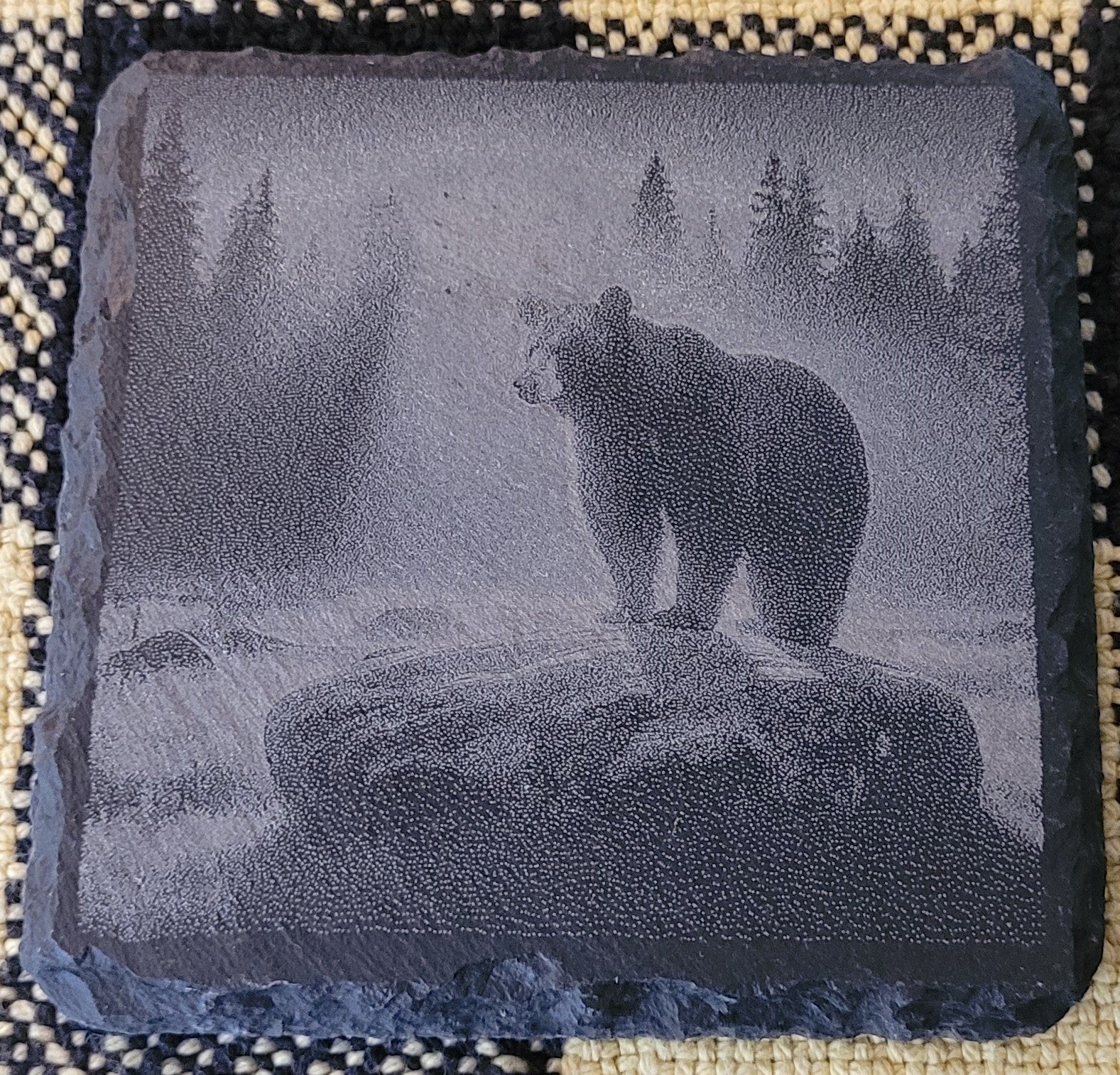 Decorative stone with engraved bear design