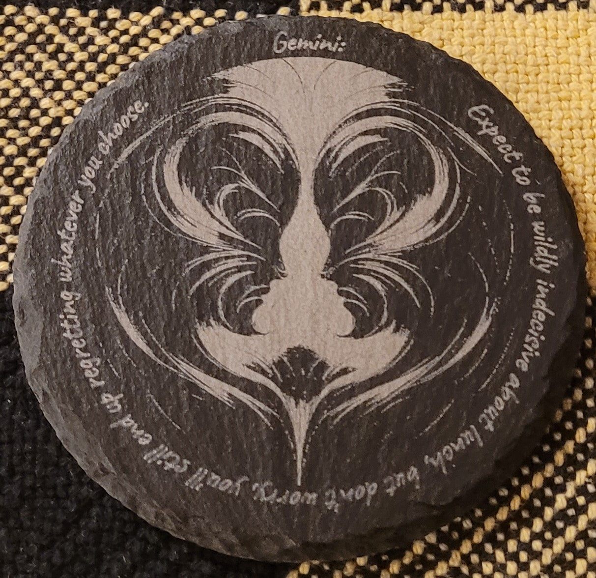Decorative stone with zodiac symbol and text