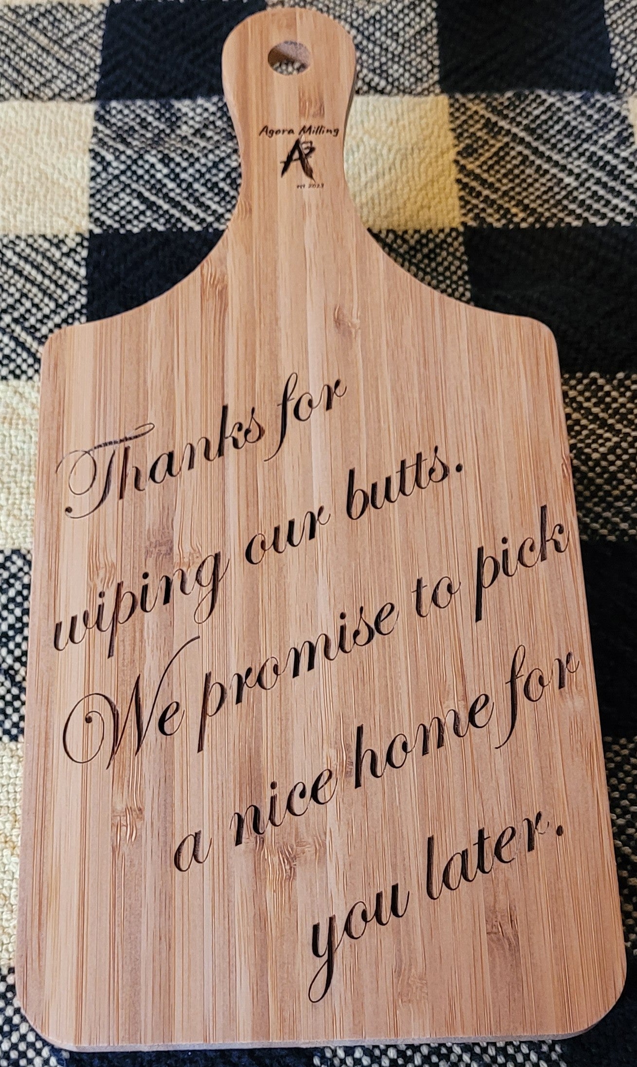 Wooden cutting board with humorous text