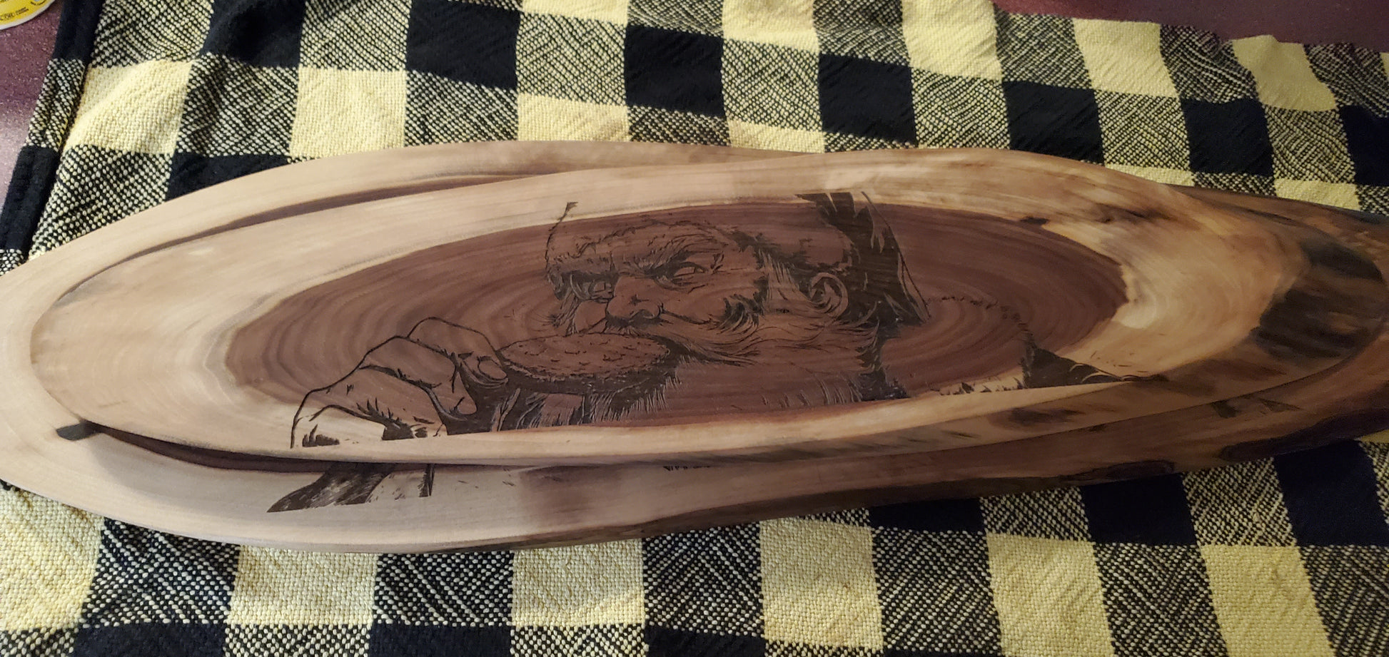 Wooden tray with engraved design of Santa eating a cookie